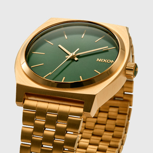 Detail shot of a gold Nixon Time Teller with a green dial