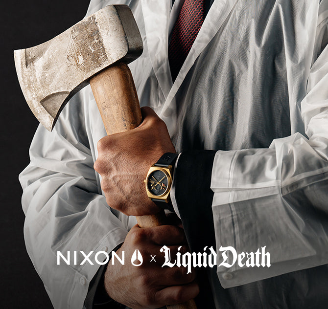 Man in white coat holding an axe, wearing a gold Nixon x Liquid Death watch.