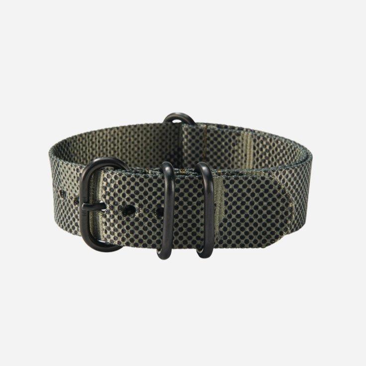 A green Nixon one piece watch strap
