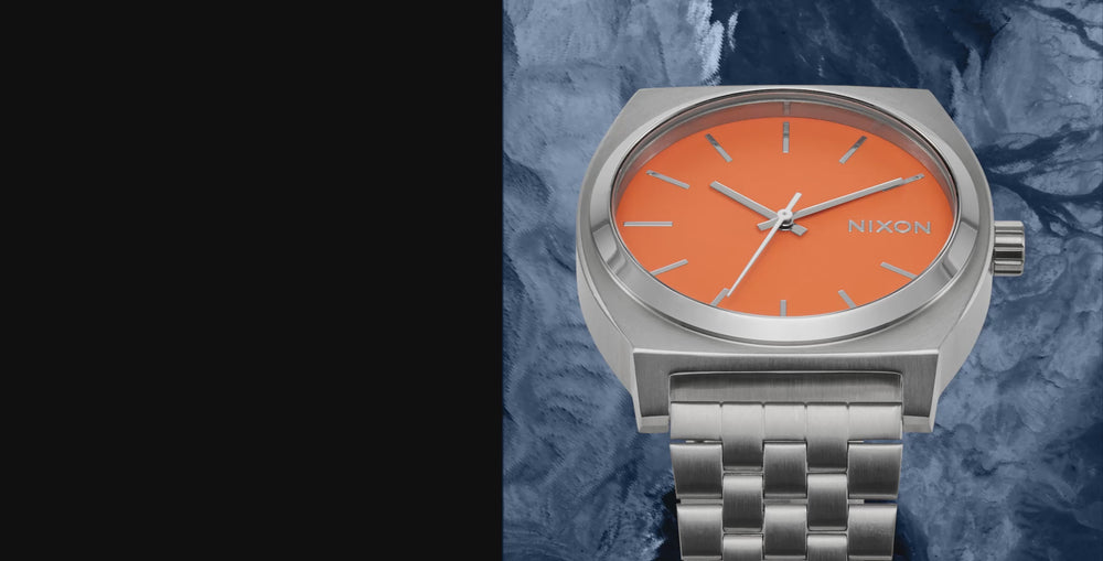 different watches rotating on blue textured background